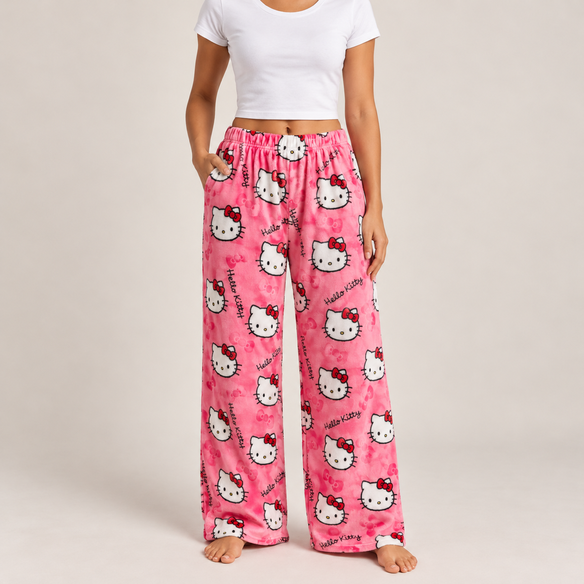 Model wearing pink wide-leg kitty print pyjama bottoms
