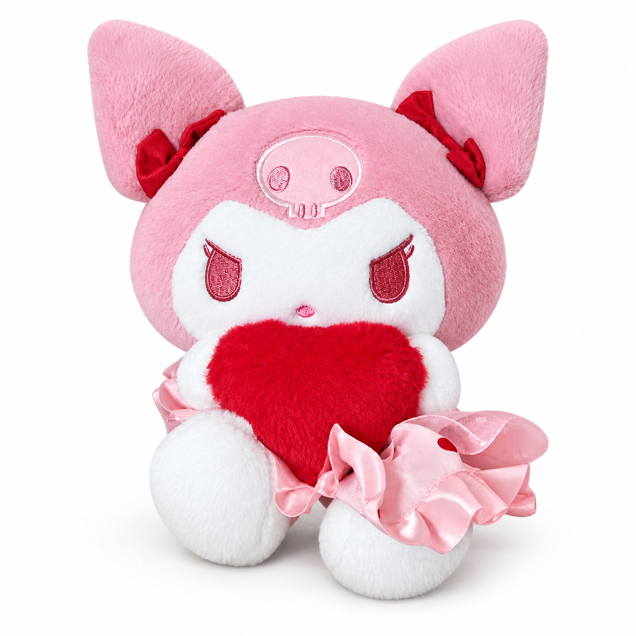 A pink-hooded jester plush holding a red heart, with embroidered face details, red ear bows, white paws and feet, and a pink ruffle skirt.